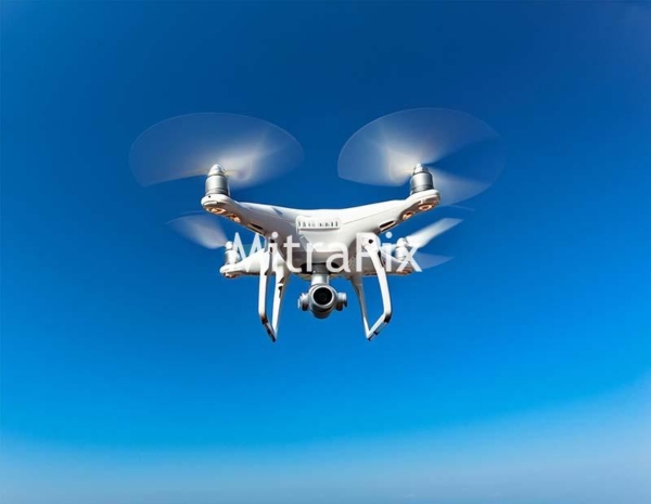 drone-in-flight-on-blue-sky
