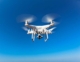 drone-in-flight-on-blue-sky