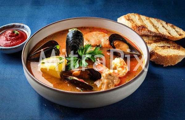 traditional-bouillabaisse-with-fresh-seafood-and-toasted-baguette